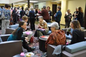 Symposium presenters and attendees deep in conversation during the breaks. Photo credits: Yolanda Kauffman