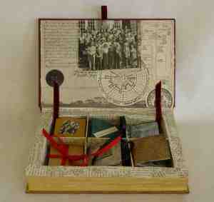 The inside of my altered book, a box with half a dozen miniature books demonstrating different techniques taught during the term and all made with original pages from the Story of Bethel College.